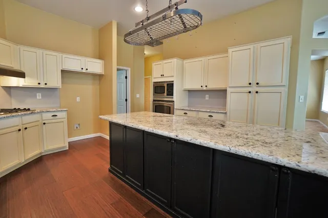 a view of an empty room with wooden walls