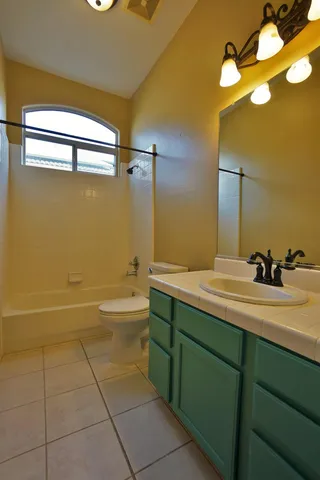 an empty room with a empty space and windows