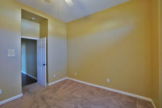 a bathroom with a tub a sink and a mirror