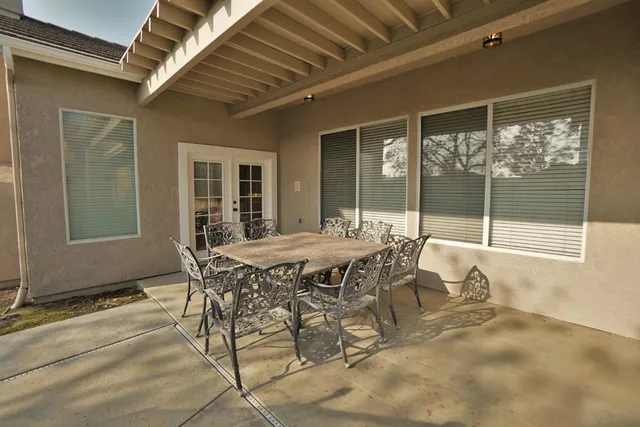 a view of a swimming pool with a patio
