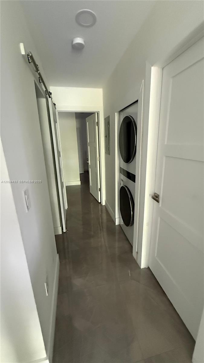 13675 Southwest 62nd Street, Unit 2023 Miami, FL 33183 - Photo 22 of 22 a view of a hallway with washer and dryer