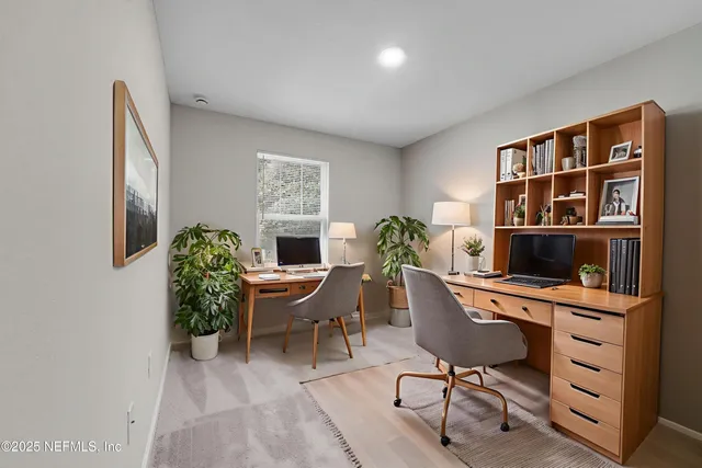 a view of a workspace with furniture