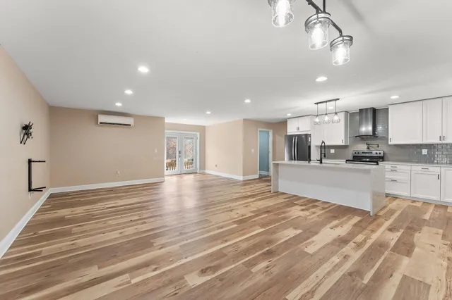 a view of kitchen with wooden floor and window