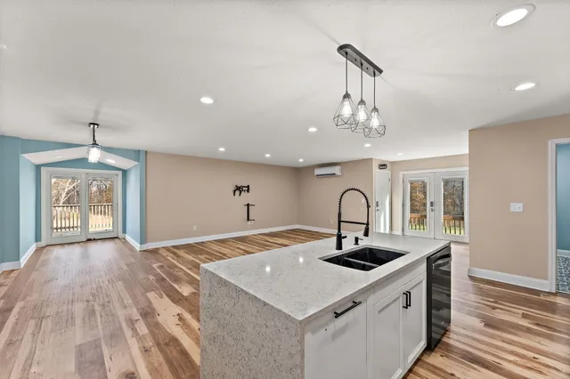 a kitchen with a sink and a stove top oven