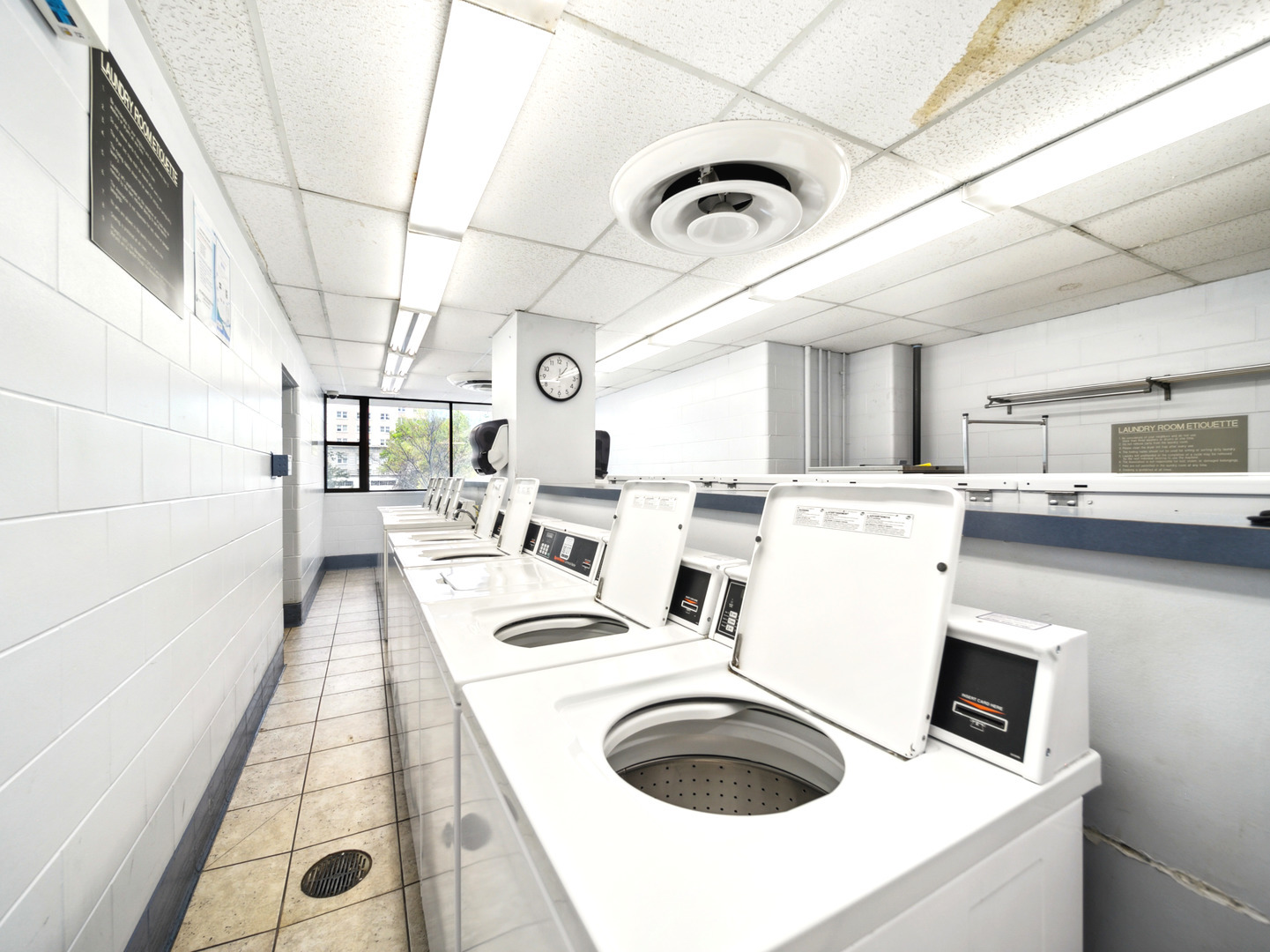 5455 North Sheridan Road, Unit 1404 Chicago, IL 60640 - Photo 19 of 24 a kitchen with a sink a stove and cabinets