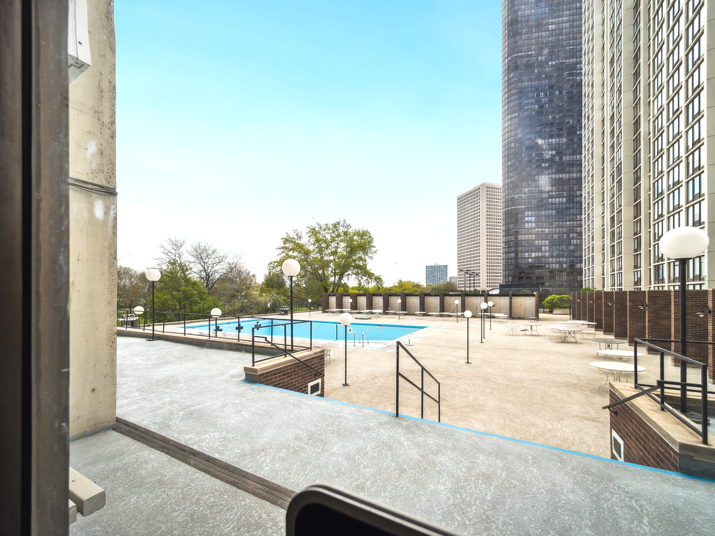 5455 North Sheridan Road, Unit 1404 Chicago, IL 60640 - Photo 20 of 24 a view of a swimming pool with a lounge chair