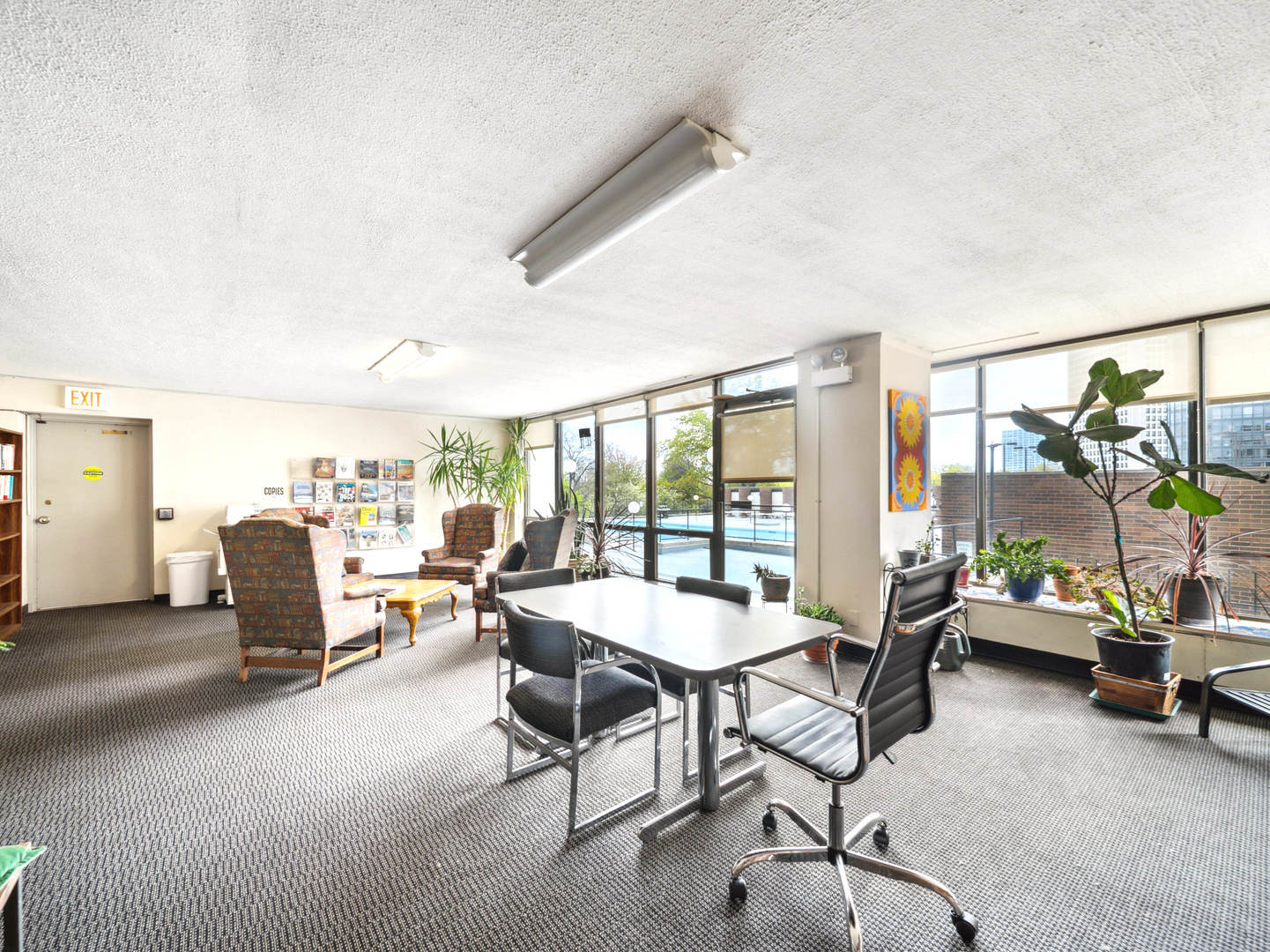 5455 North Sheridan Road, Unit 1404 Chicago, IL 60640 - Photo 23 of 24 a living room with furniture and a large window