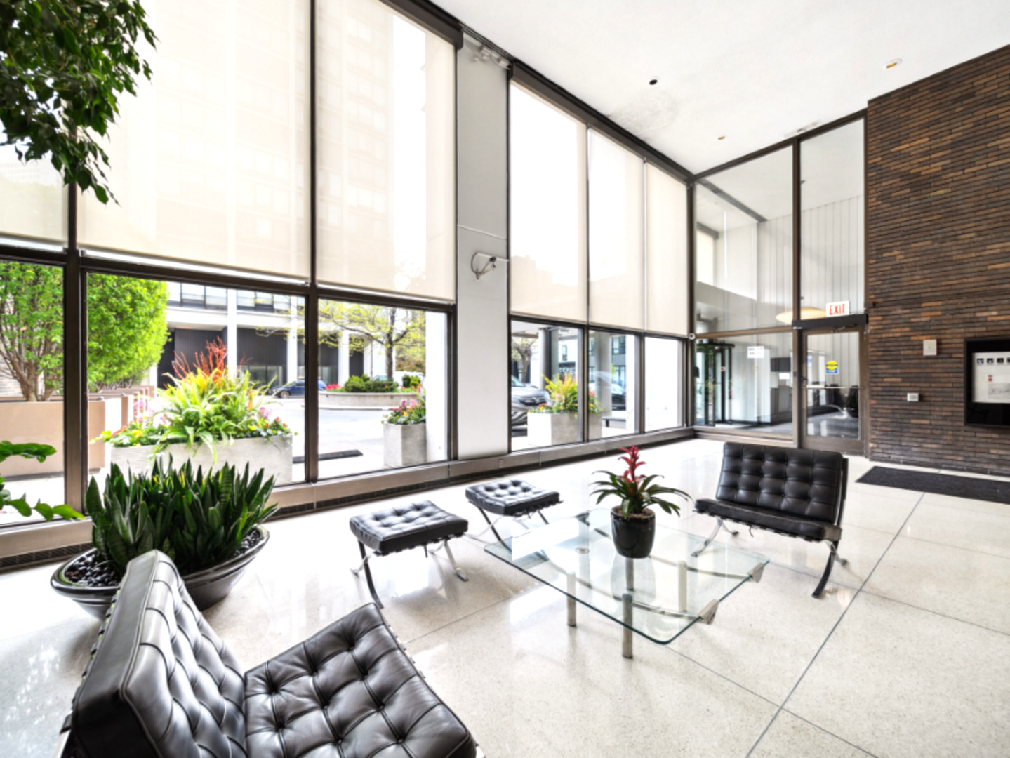 5455 North Sheridan Road, Unit 1404 Chicago, IL 60640 - Photo 3 of 24 a living room with furniture and floor to ceiling windows