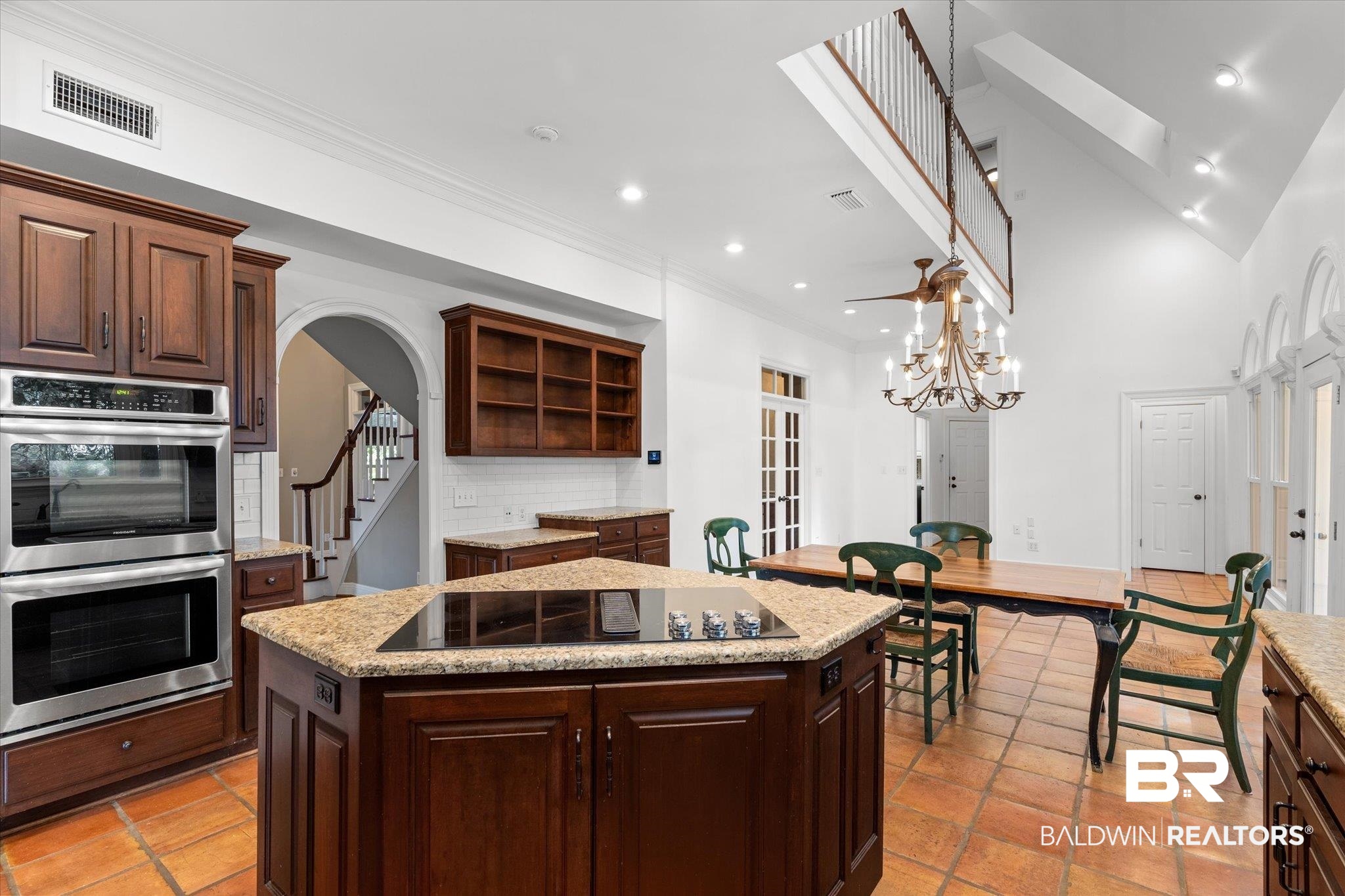 5231 Dawes Road Grand Bay, AL 36541 - Photo 14 of 49 Kitchen with a center island, stainless steel double oven, backsplash, a skylight, and black electric cooktop