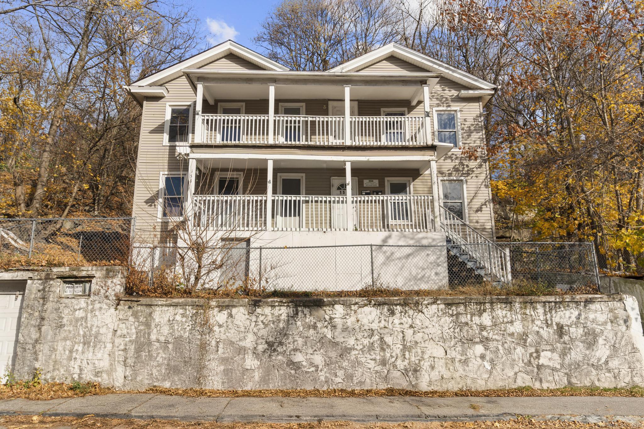 156 Orange Street Waterbury, CT 06704 - Photo 1 of 32 a front view of a house with a yard