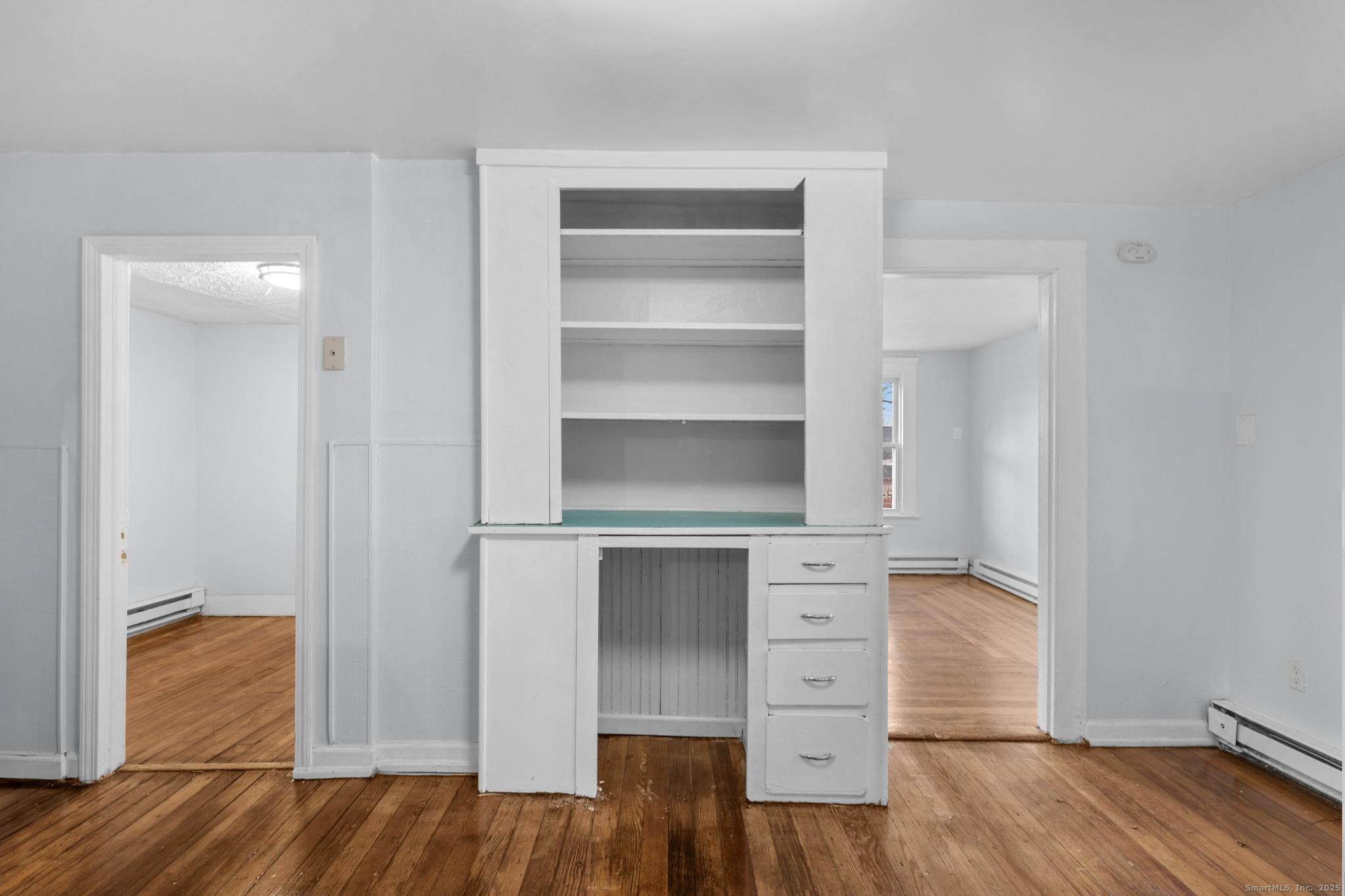 156 Orange Street Waterbury, CT 06704 - Photo 19 of 32 a view of walk in closet with empty racks