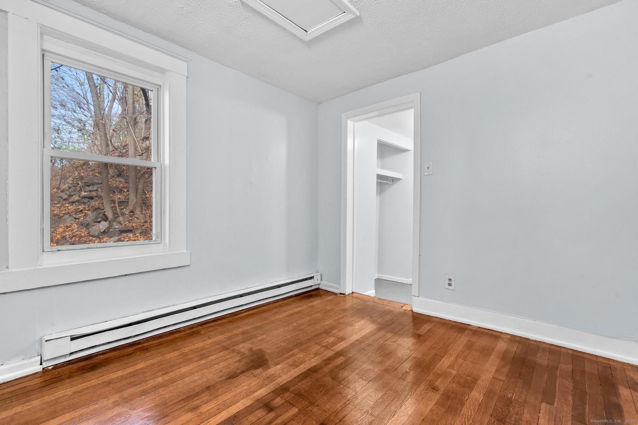 156 Orange Street Waterbury, CT 06704 - Photo 21 of 32 an empty room with window