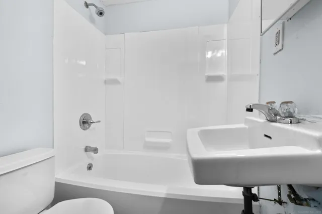 a bathroom with a sink and bathtub