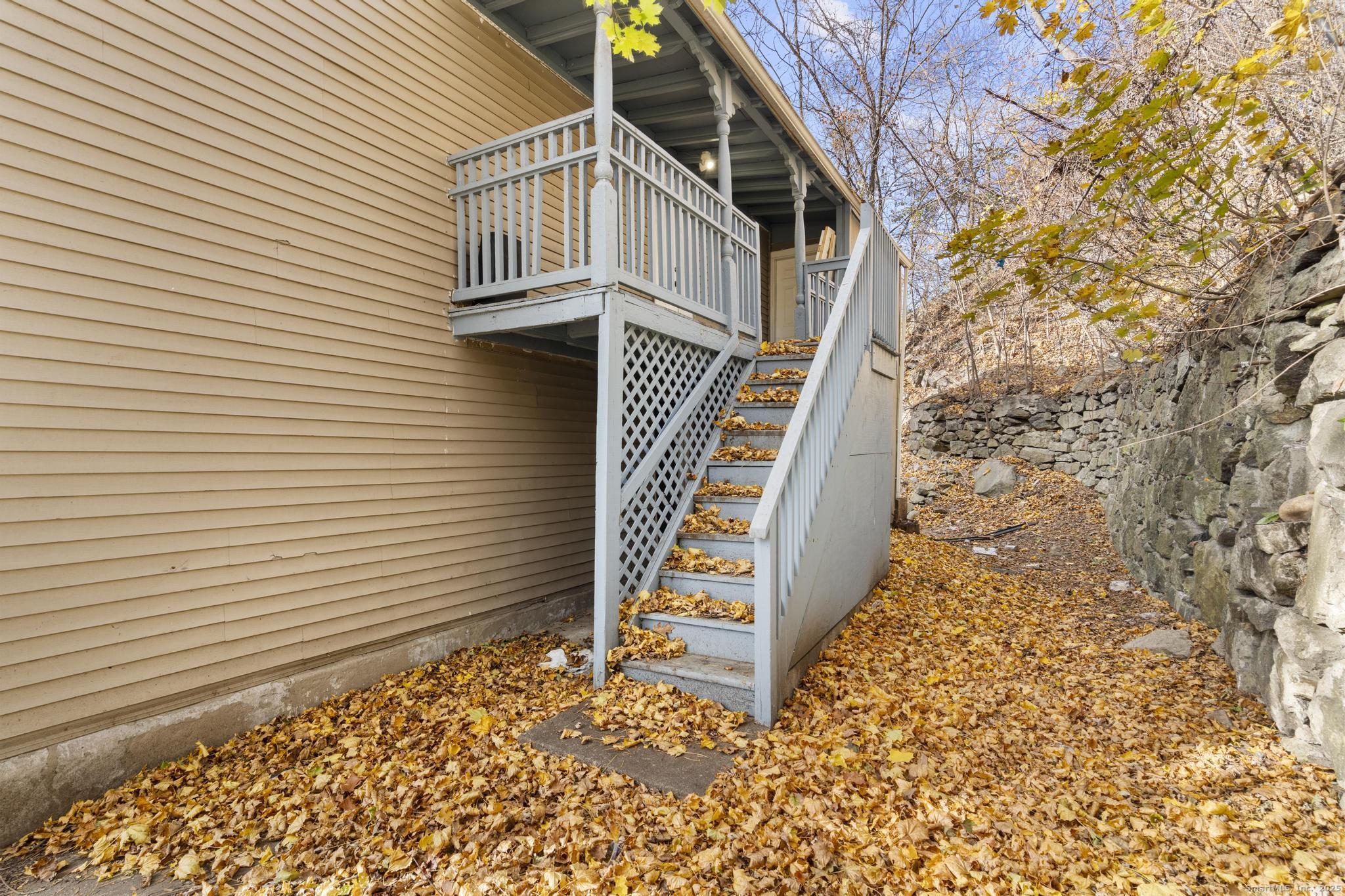 156 Orange Street Waterbury, CT 06704 - Photo 28 of 32 a view of a house with a yard