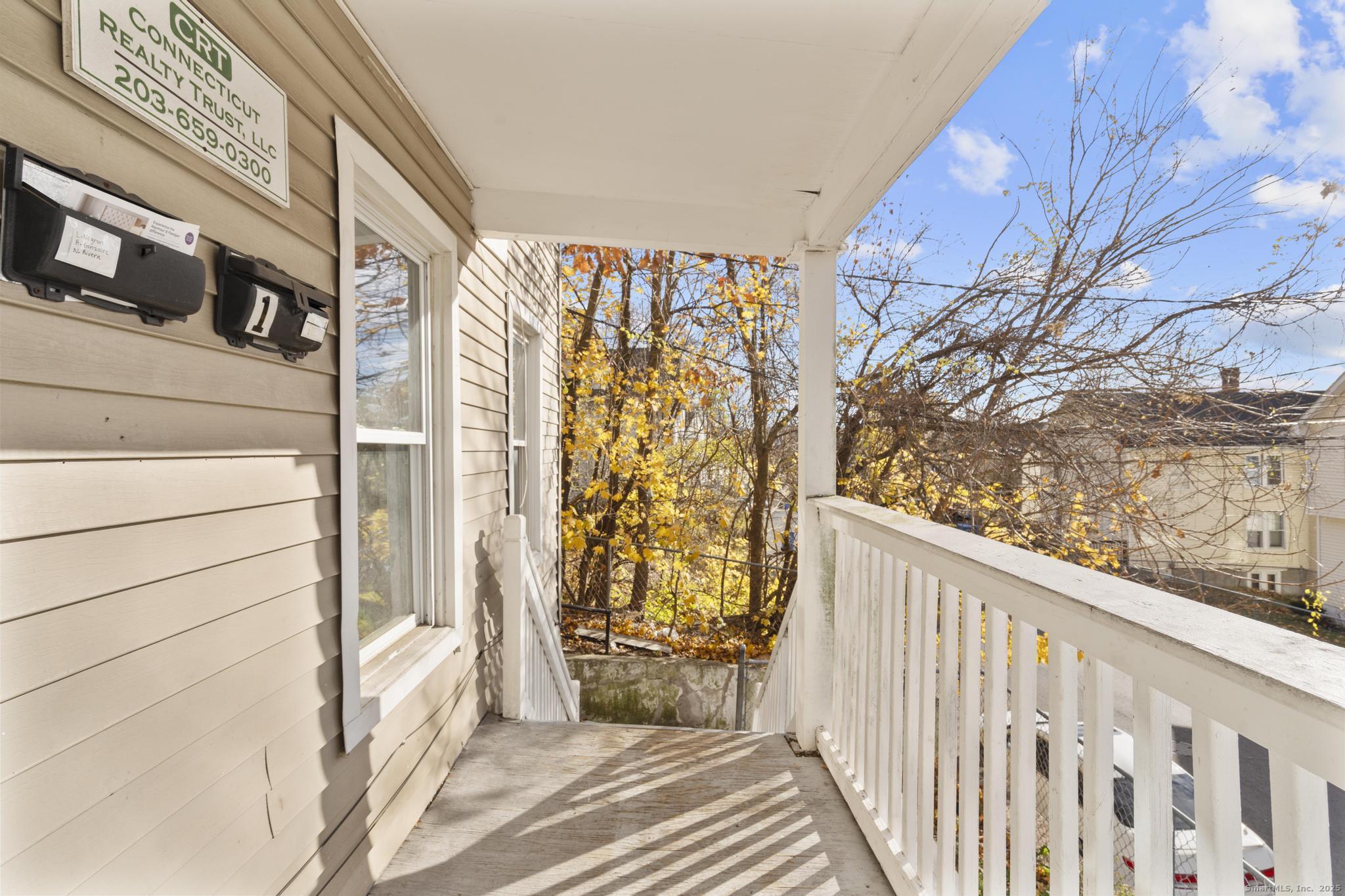 156 Orange Street Waterbury, CT 06704 - Photo 30 of 32 a view of a door and wooden floor