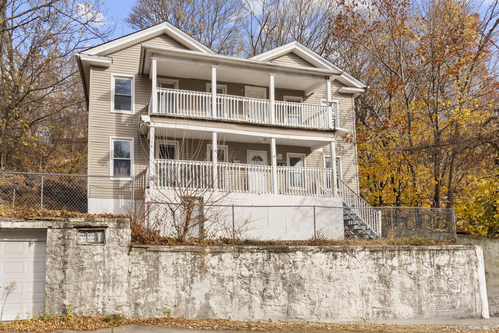 156 Orange Street Waterbury, CT 06704 - Photo 31 of 32 a front view of a house with a yard