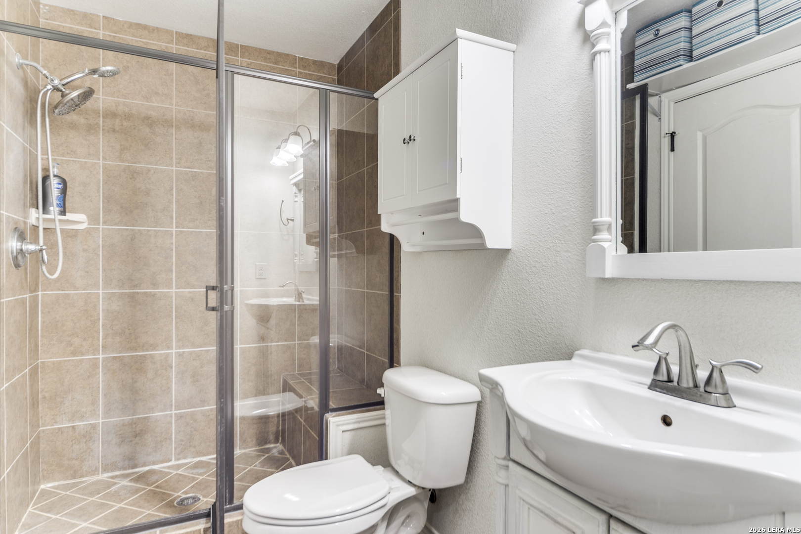 1145 Bob White Drive Spring Branch, TX 78070 - Photo 14 of 27 a bathroom with a sink toilet and shower