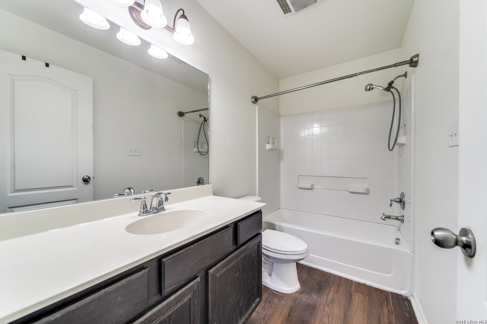 1145 Bob White Drive Spring Branch, TX 78070 - Photo 18 of 27 a bathroom with a sink a toilet and shower
