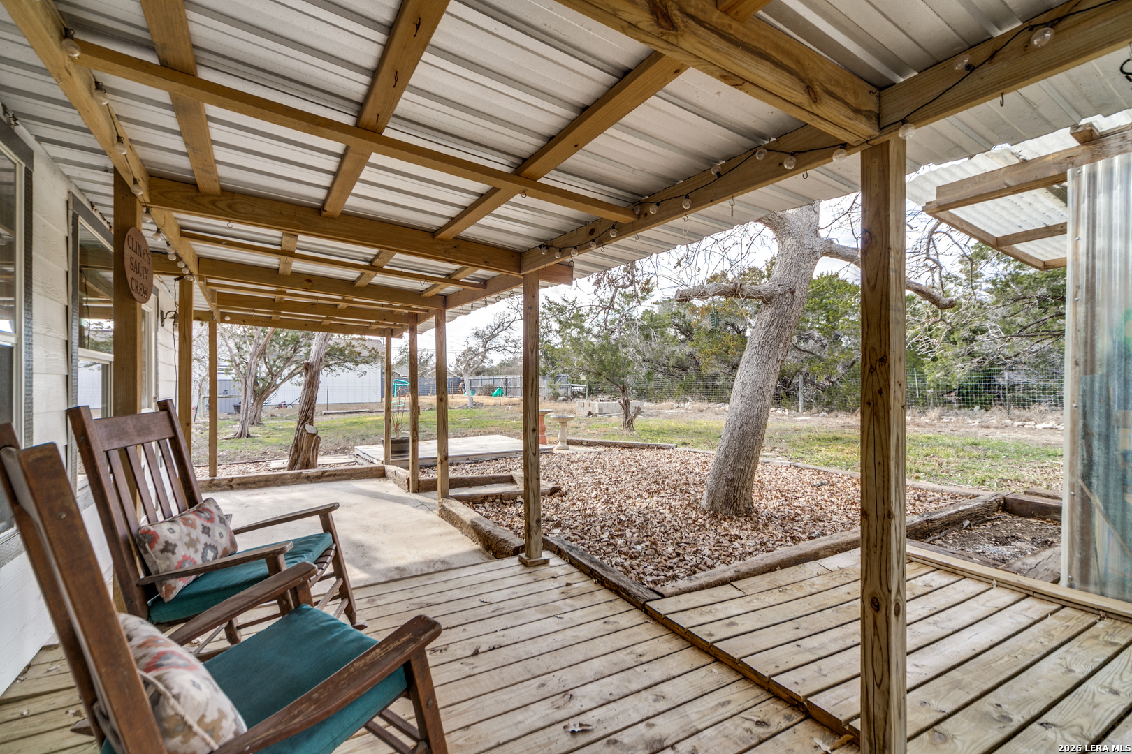 1145 Bob White Drive Spring Branch, TX 78070 - Photo 19 of 27 a view of a balcony with couch and wooden floor