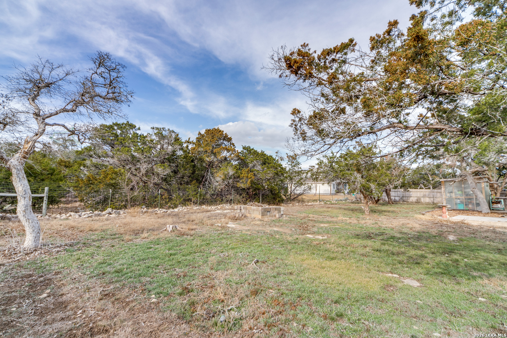 1145 Bob White Drive Spring Branch, TX 78070 - Photo 24 of 27 a view of dirt yard with large trees