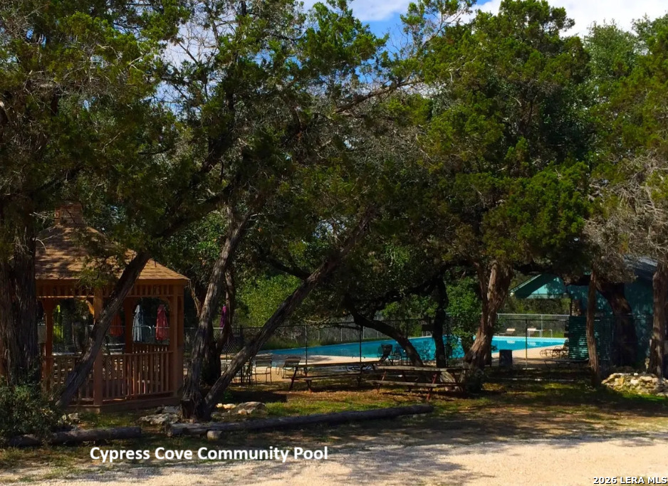 1145 Bob White Drive Spring Branch, TX 78070 - Photo 27 of 27 a view of a house with trees in the background