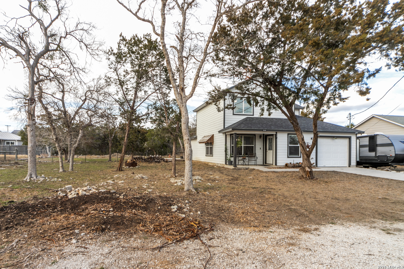 1145 Bob White Drive Spring Branch, TX 78070 - Photo 3 of 27 a front view of a house with garden