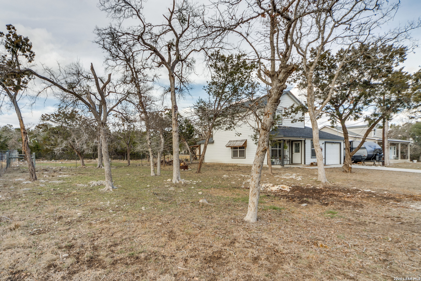 1145 Bob White Drive Spring Branch, TX 78070 - Photo 4 of 27 a backyard of a house with lots of green space