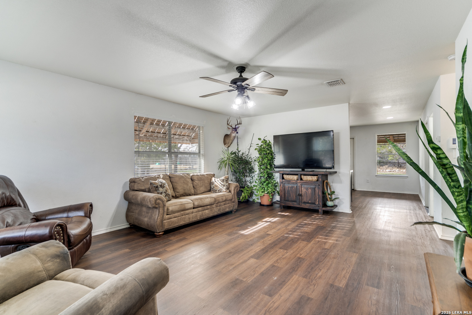 1145 Bob White Drive Spring Branch, TX 78070 - Photo 6 of 27 a living room with furniture and a flat screen tv