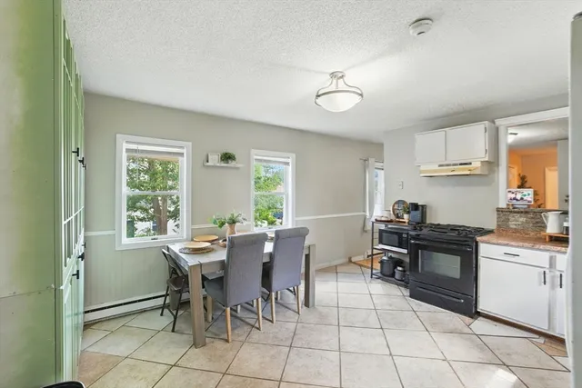 a kitchen with a stove a refrigerator and a sink