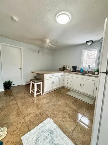 a kitchen with stainless steel appliances a sink and cabinets