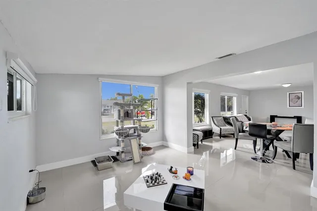 a white toilet sitting next to a shower curtain