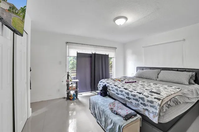 a bedroom with a bed and a cabinets