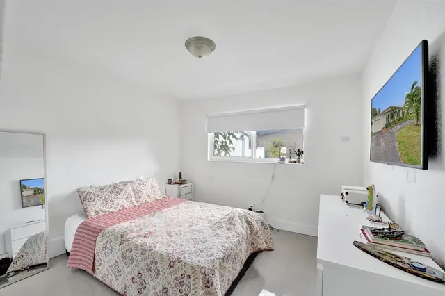a kitchen with kitchen island granite countertop a sink stove and refrigerator