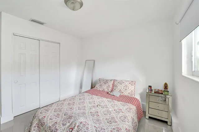 a kitchen with stainless steel appliances granite countertop a sink a stove and a microwave