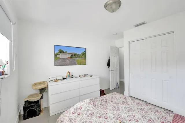 a bathroom with a granite countertop sink a mirror and a window