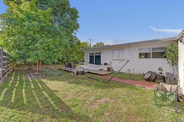a backyard of a house with lots of green space