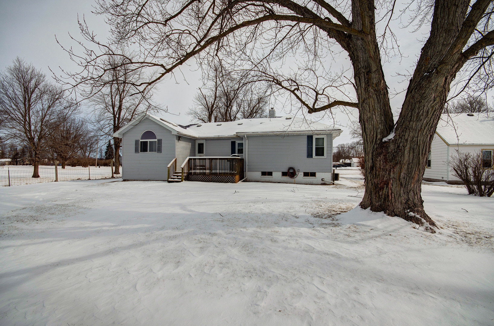 1168 South 5000W Road Kankakee, IL 60901 - Photo 26 of 30 a view of house with a yard covered in snow