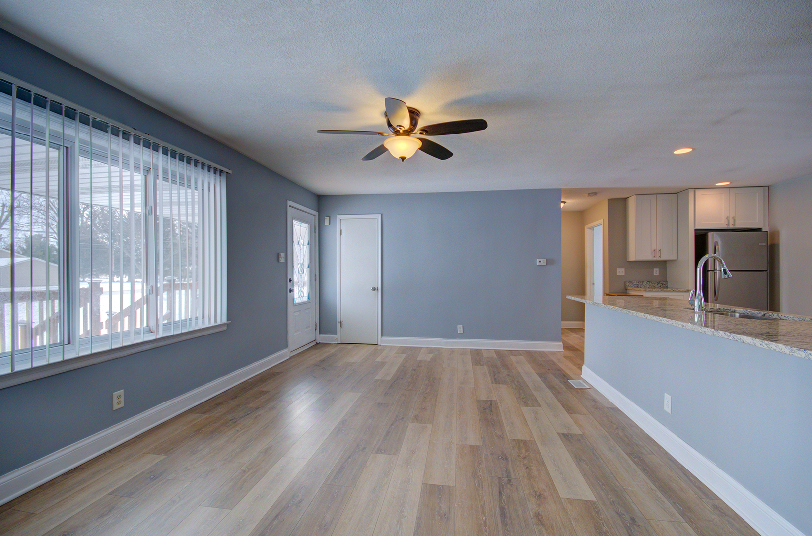 1168 South 5000W Road Kankakee, IL 60901 - Photo 6 of 30 a view of a kitchen with a sink and a window