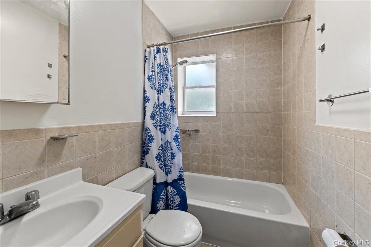 1309 Vreeland Avenue, Unit 2 Bronx, NY 10461 - Photo 8 of 13 a bathroom with a sink toilet and shower