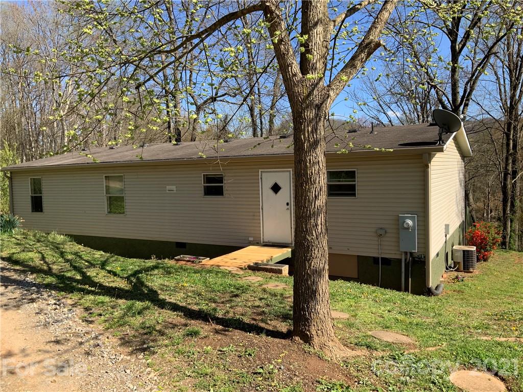 388 Richards Ridge Canton, NC 28716 - Photo 1 of 22 a backyard of a house with large trees