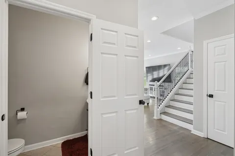 a view of entryway with wooden floor and staircase