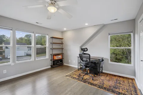 a living room with furniture and a window