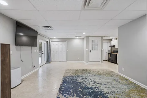 a view of a livingroom with a kitchen