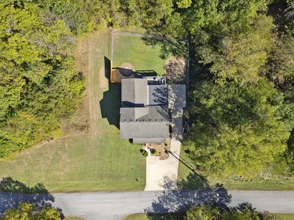 aerial view of a house with a yard