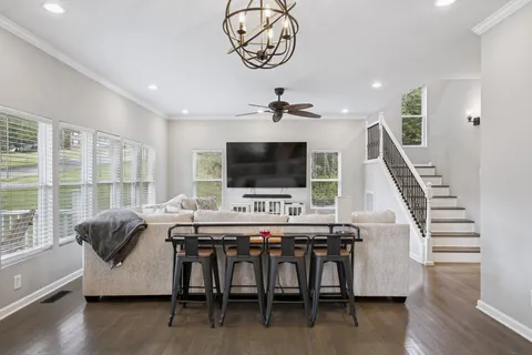 a view of a dining room with furniture window and wooden floor