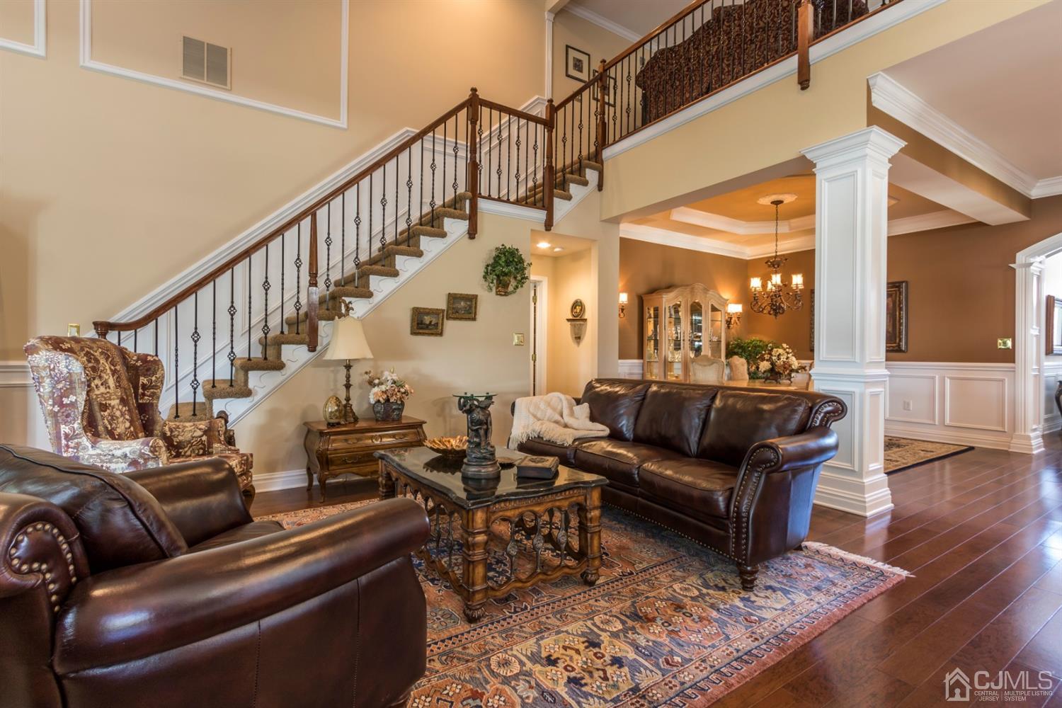 28 Kings Mill Road Monroe Township, NJ 08831 - Photo 12 of 42 a living room with furniture wooden floor and a chandelier