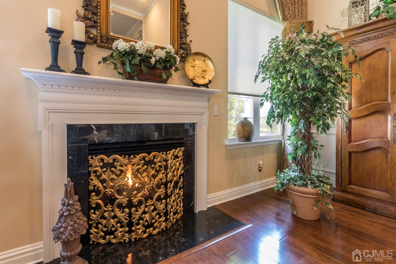 28 Kings Mill Road Monroe Township, NJ 08831 - Photo 13 of 42 a room with a fireplace and wooden floor