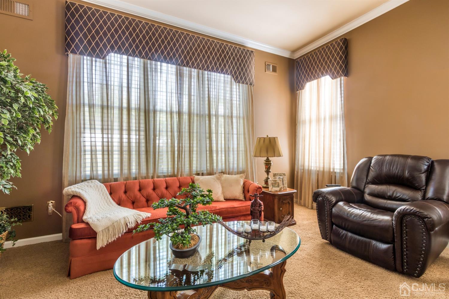 28 Kings Mill Road Monroe Township, NJ 08831 - Photo 27 of 42 a living room with furniture and floor to ceiling windows