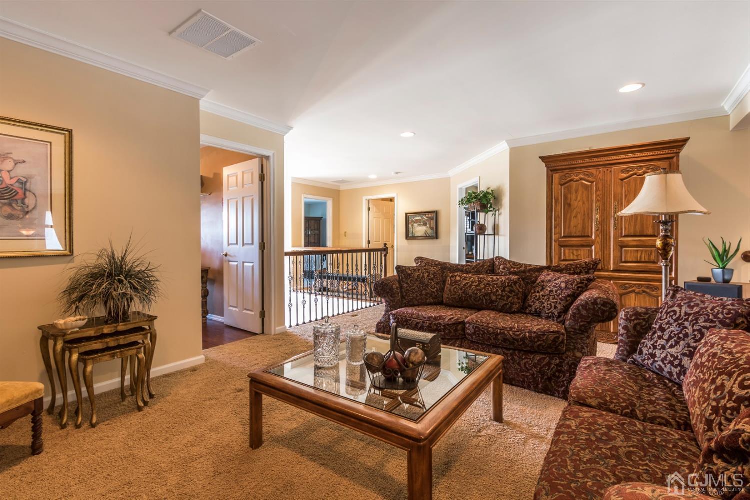 28 Kings Mill Road Monroe Township, NJ 08831 - Photo 31 of 42 a living room with furniture and a table