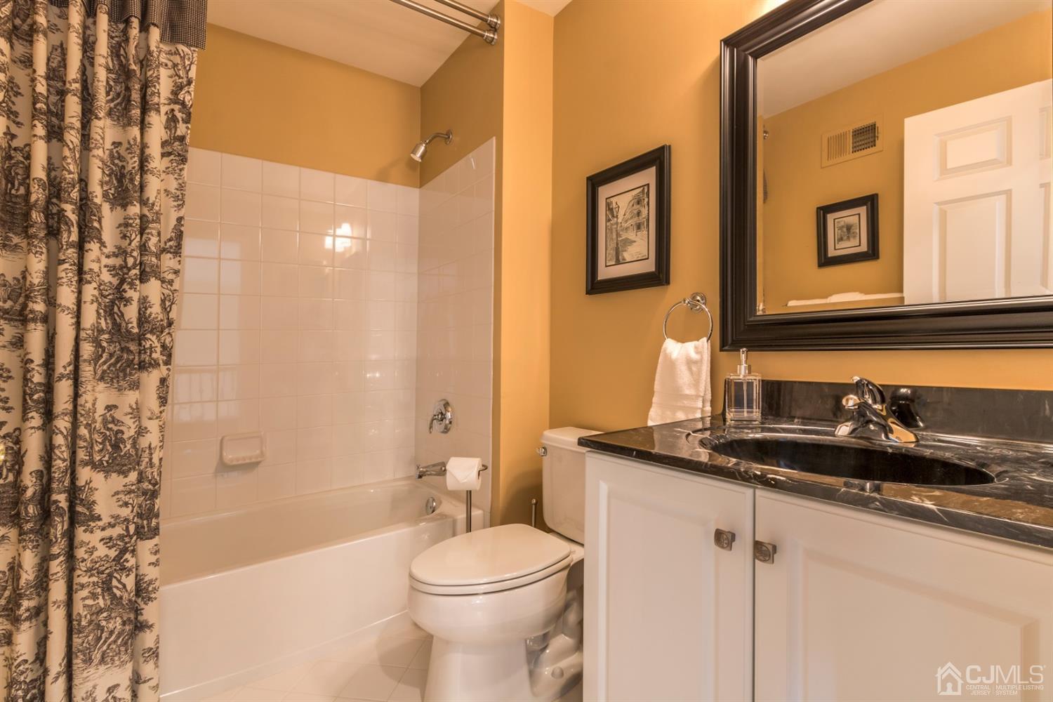 28 Kings Mill Road Monroe Township, NJ 08831 - Photo 35 of 42 a bathroom with a granite countertop sink mirror vanity and toilet